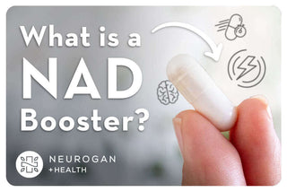 Holding NAD capsule. Text: What is a NAD Booster?