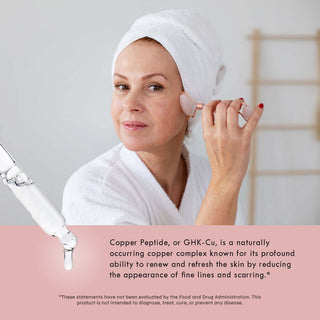 Woman applying Copper Peptide Serum, showing rejuvenating benefits for fine lines and scarring*.
