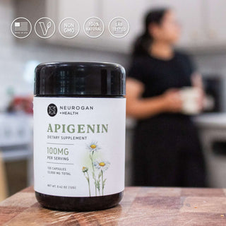 Apigenin bottle on kitchen counter, vegan-friendly, non-GMO, lab-tested icons.