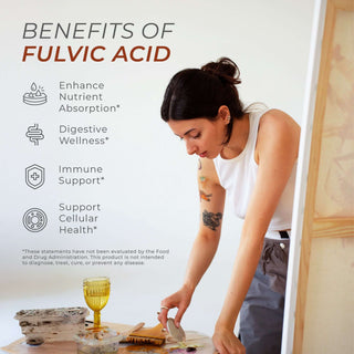 Woman preparing food beside text showing benefits of Fulvic Acid including absorption and immunity.