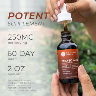 Hand holding Fulvic Acid bottle with dropper. Text shows 250mg per serving, 60-day supply, and third-party lab tested.