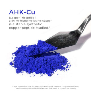 Bright blue AHK-Cu copper peptide powder on spatula with compound description.