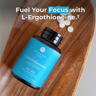 L-Ergothioneine Tablets bottle on a wooden table, promoting cognitive health and focus with 300 mg dosage.