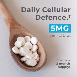 L-Ergothioneine Tablets in a wooden spoon, featuring 5MG per tablet for daily cellular defense.
