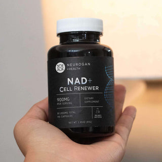 Handheld bottle of NAD+ capsules Supplement.