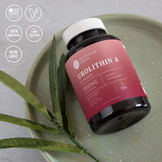 Urolithin A Gummies bottle on plate with icons for vegan, non-GMO, and lab-tested formula.