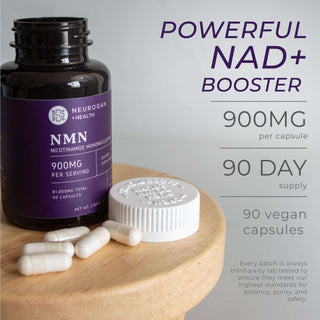 NMN Capsules bottle with loose capsules on a wooden chair, 900mg per serving, 90-day supply total per bottle.