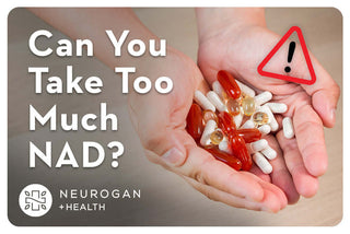 Holding a handful of supplements. Text: Can you take too much NAD?