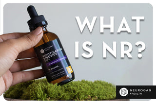 Nicotinamide Riboside Drops bottle held over green moss with 'What is NR?' title