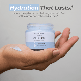 Hand holding Neurogan's Advanced GHK-Cu Copper Peptide Face Cream 2400mg, demonstrating deep hydration for vibrant skin.