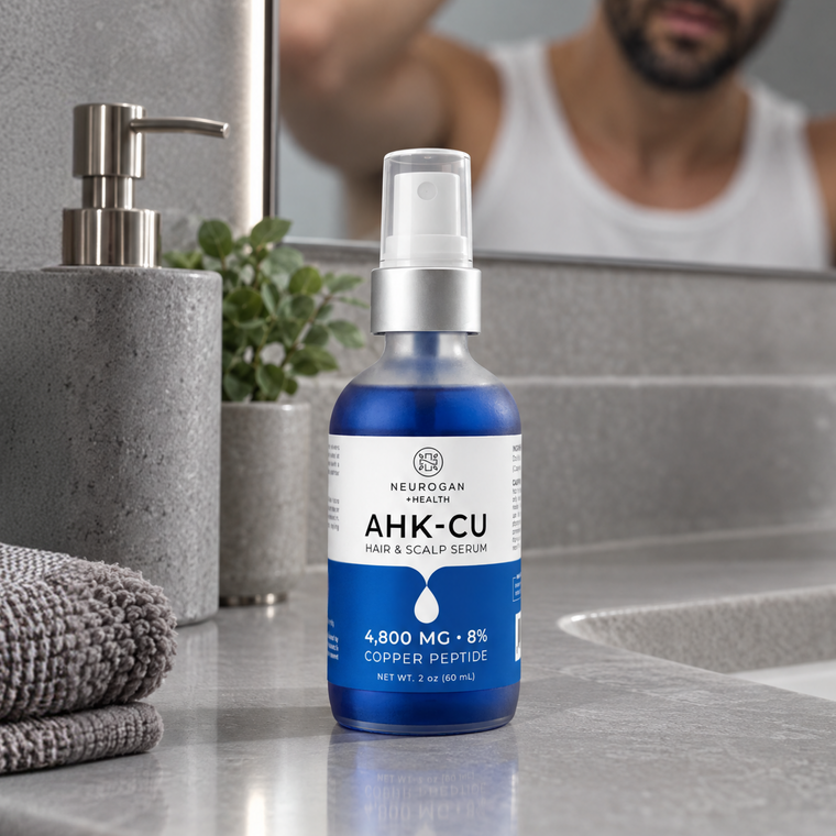 AHK-Cu Copper Peptide Hair Serum bottle on a bathroom counter