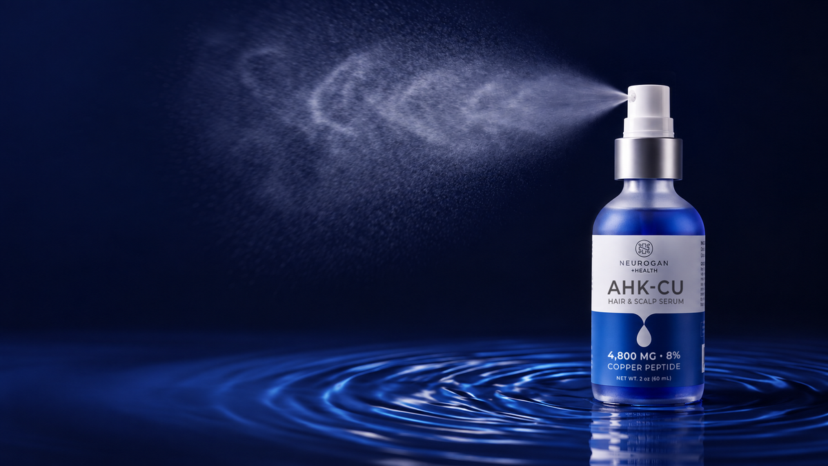 AHK-Cu Copper Peptide Hair Serum spray bottle releasing a fine mist