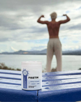 Fisetin supplement jar with a muscular man in the background, showcasing fitness and wellness by the seaside.