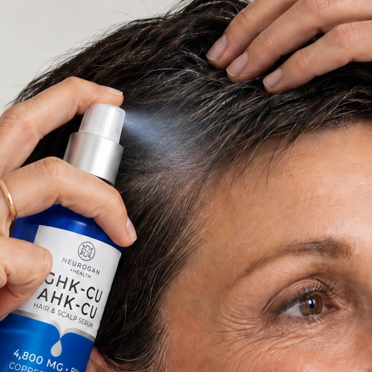Spraying Hair Serum Pro along the hairline
