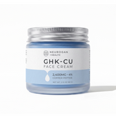 Frosted blue glass jar of Neurogan Health GHK-Cu Face Cream with a silver screw-on lid and white/light-blue label reading '2,400MG - 4% Copper Peptide' and Net Wt. 2.12 oz (60 g), on a white background.