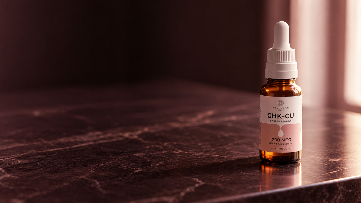 GHK-Cu Neck & Face Serum amber dropper bottle on a dark marble counter