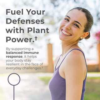 Smiling woman promoting plant-powered immune health and resilience outdoors.