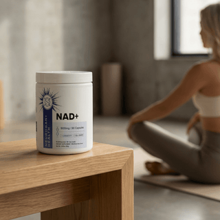 NAD+ Capsules bottle displayed on a wooden table with a woman meditating in the background, promoting healthy aging.