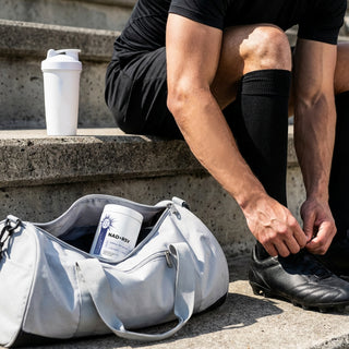 NAD + Resveratrol Capsules in a gym bag beside a sportsman preparing for training, promoting healthy aging and vitality.