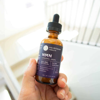 Handheld NMN Liposomal Drops bottle.