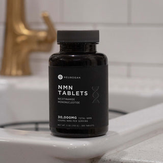 Close-up of NMN Tablets, 300 tablets total, shown on a bathroom setting.