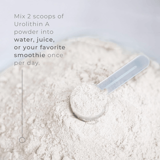 Urolithin A powder in a scoop, recommended for mixing with water, juice, or smoothies for daily use.