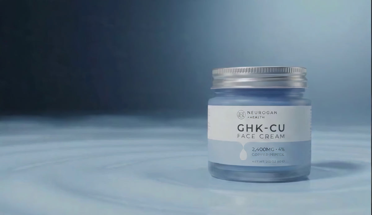 Closed jar of Advanced GHK-Cu Copper Peptide Face Cream on a surface of pale blue cream