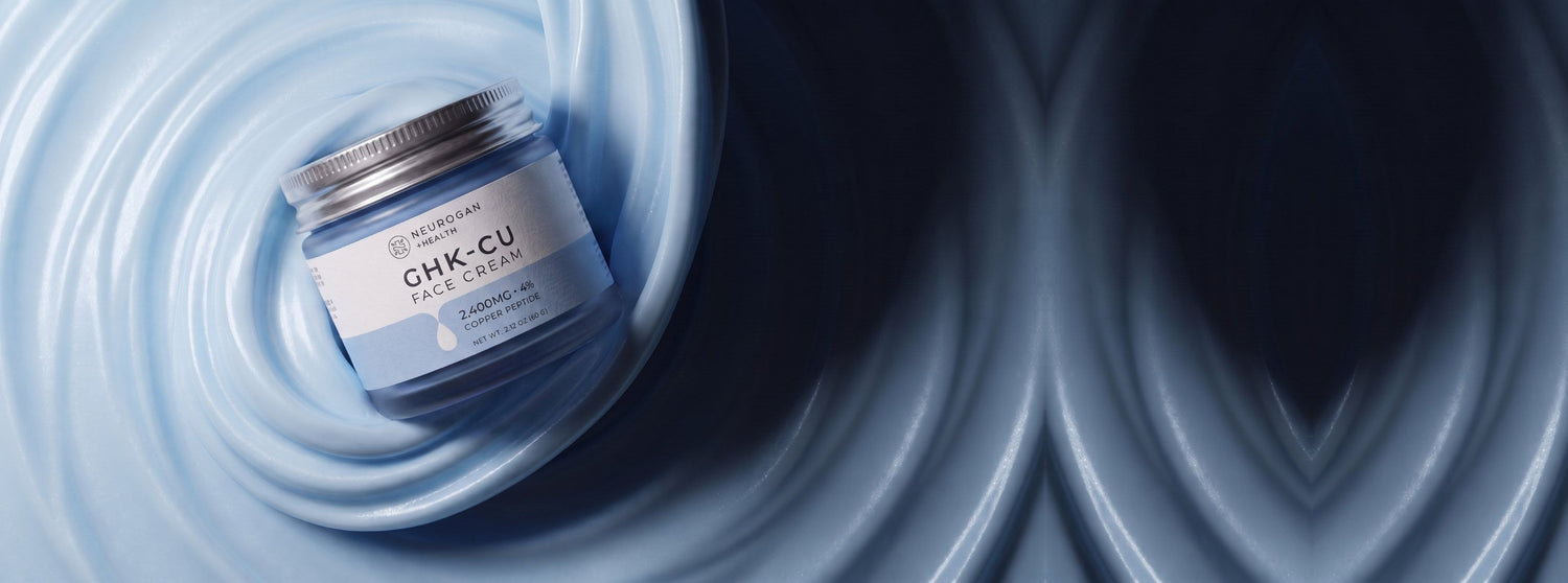 Advanced GHK-Cu Copper Peptide Face Cream jar resting on a swirl of pale blue cream